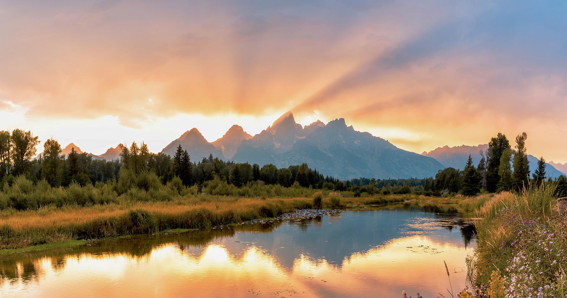 Sunrise over jagged mountain peaks